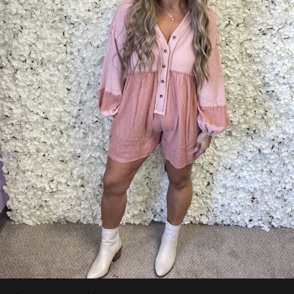 A romper from fantastic fawn with a half button down front